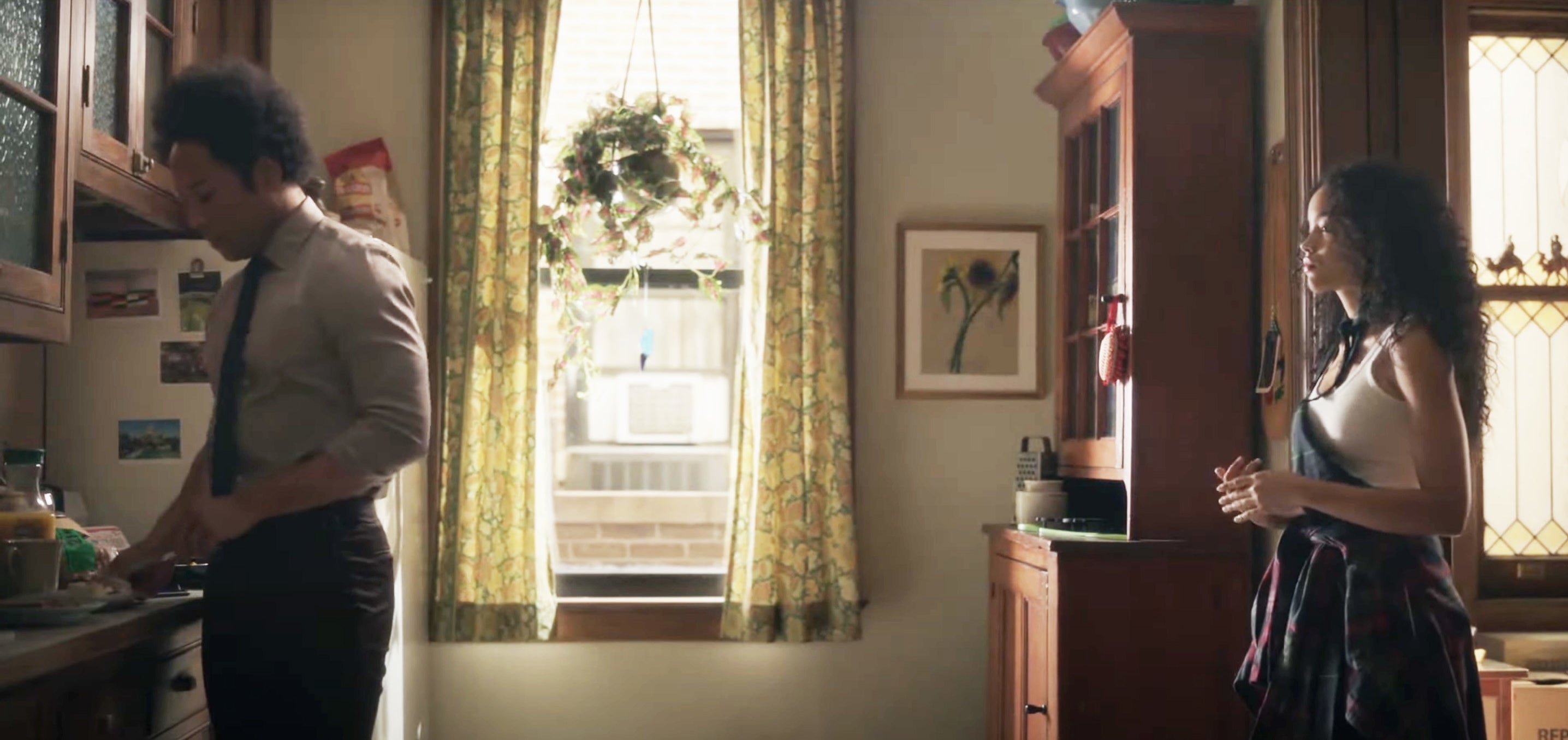 a woman looking at a man's back