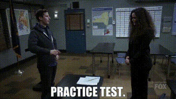 Jake Peralta points at a desk and says, &quot;Practice test&quot;