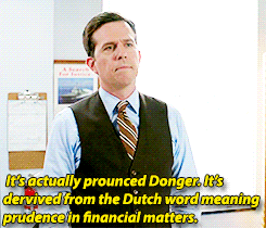 A man in a suit vest speaks as yellow text below reads &quot;It&#x27;s actually pronounced Donger, it&#x27;s derived from the Dutch word meaning prudence in financial matters&quot;
