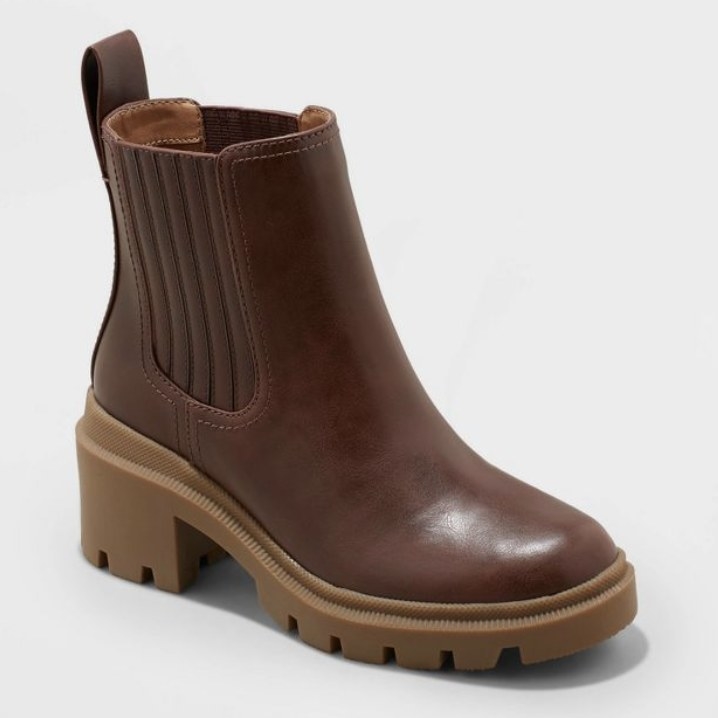 The brown boots have a thick tan platform sole