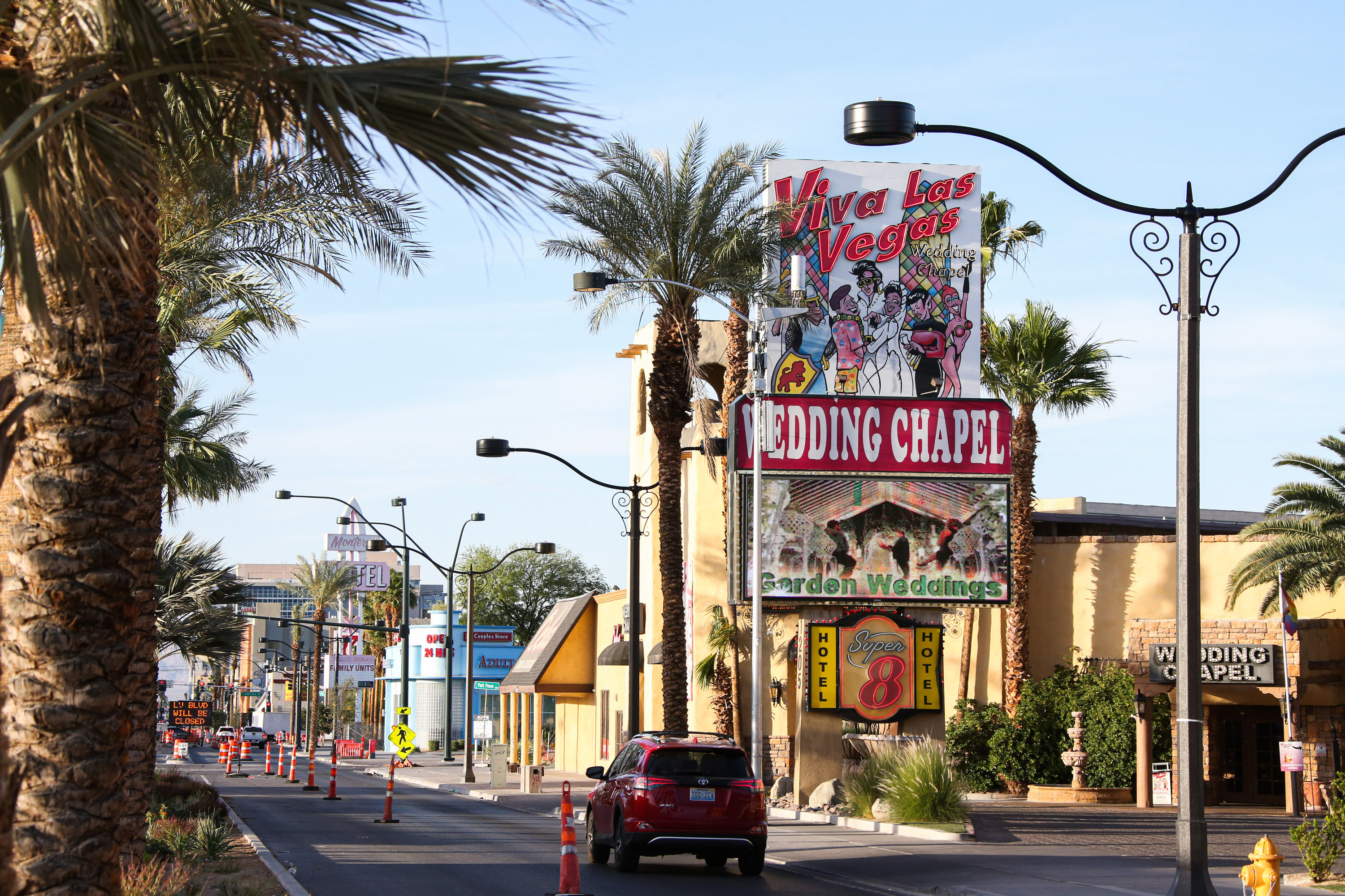 Las Vegas wedding chapped on Las Vegas strip, palm trees surround the buildings