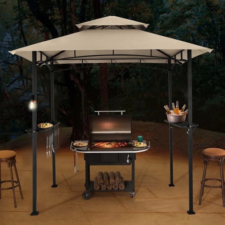 The steel grill gazebo in tan over a grill