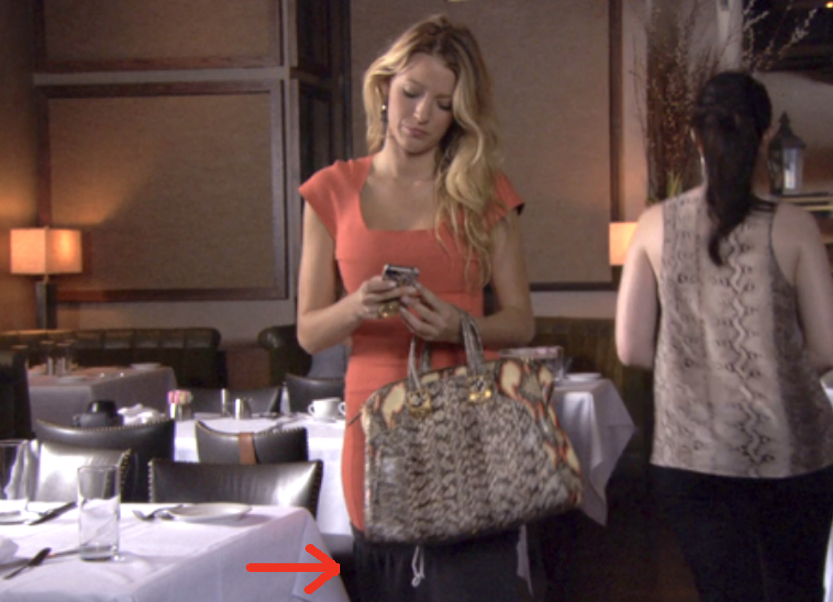 arrows pointing to the sweats under a bodycon dress in a nice restaurant