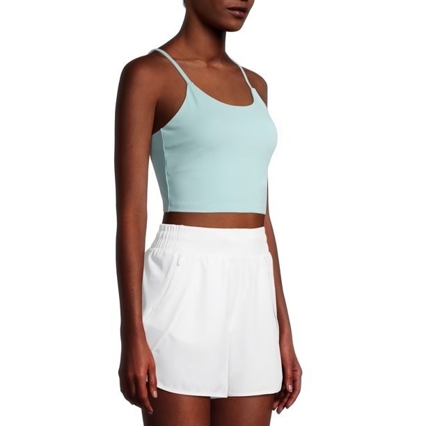 a model wearing the mint green top