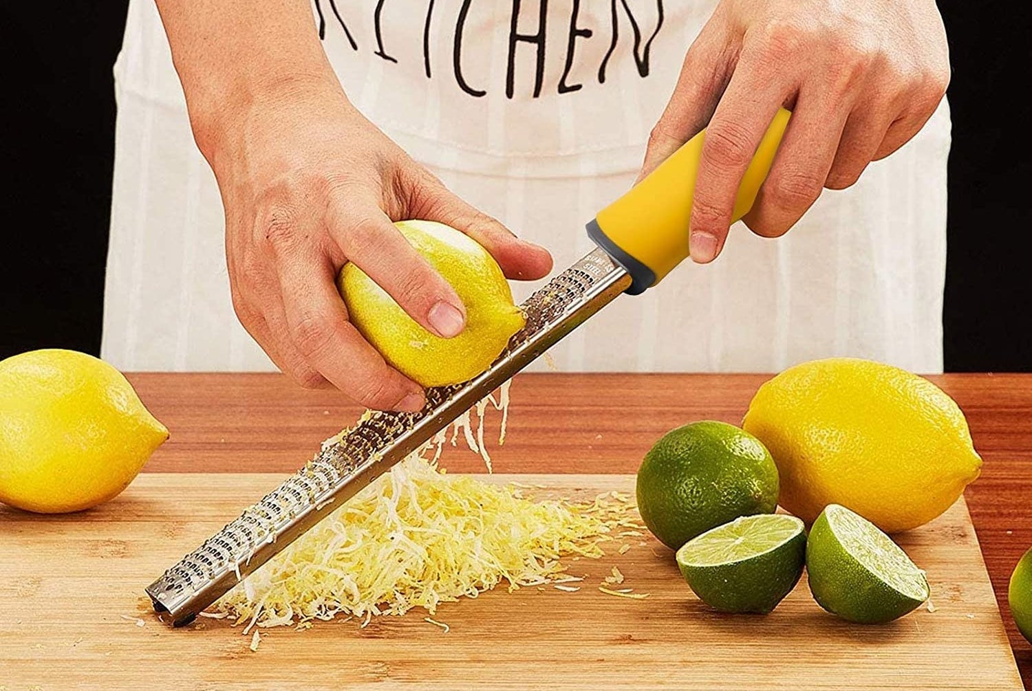 person zesting a lemon with the utensil