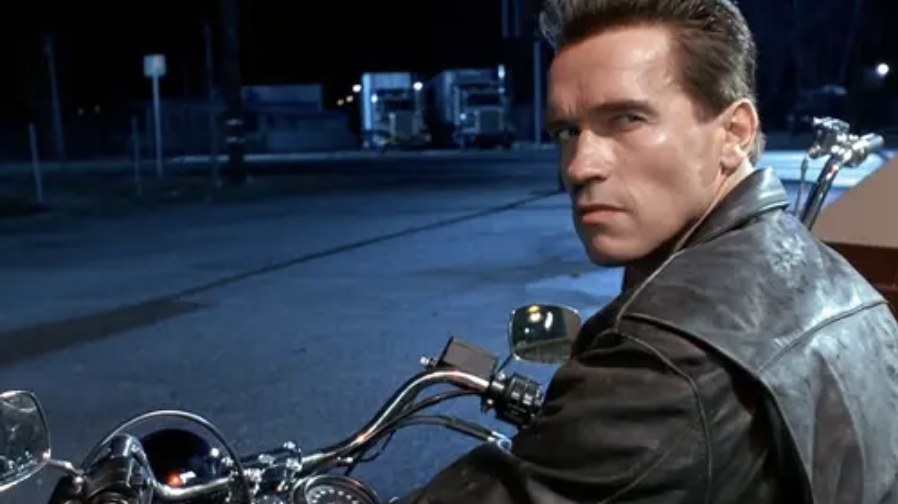 Arnold Schwarzenegger as the Terminator on a motorcycle