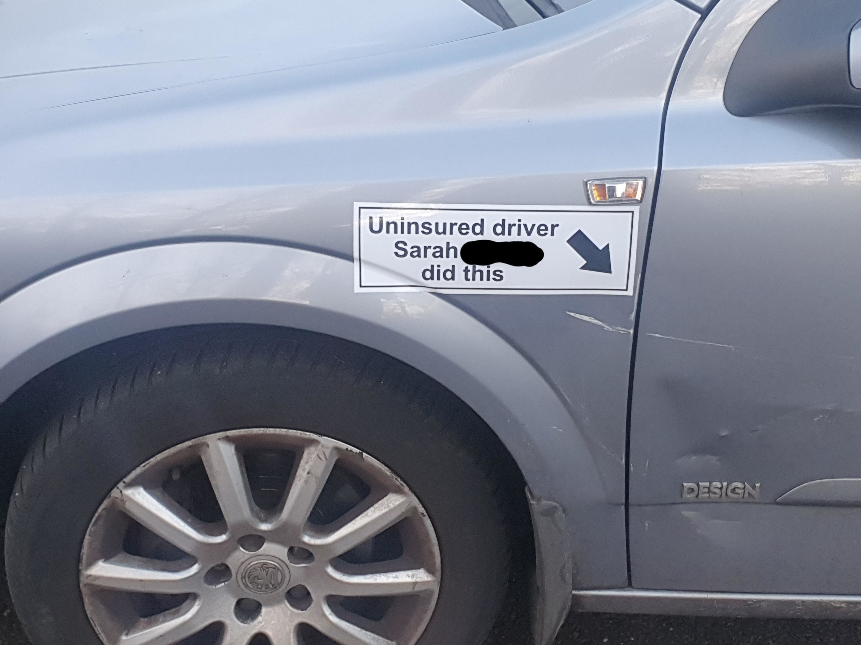 person puts a sticker saying who hurt their car