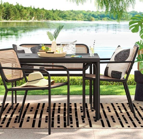 The chairs around a table with a bench