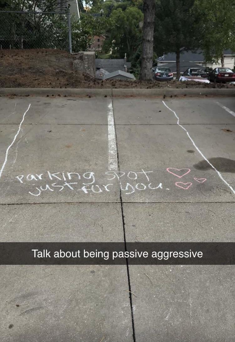 passive aggressive chalk lines around a poorly parked car