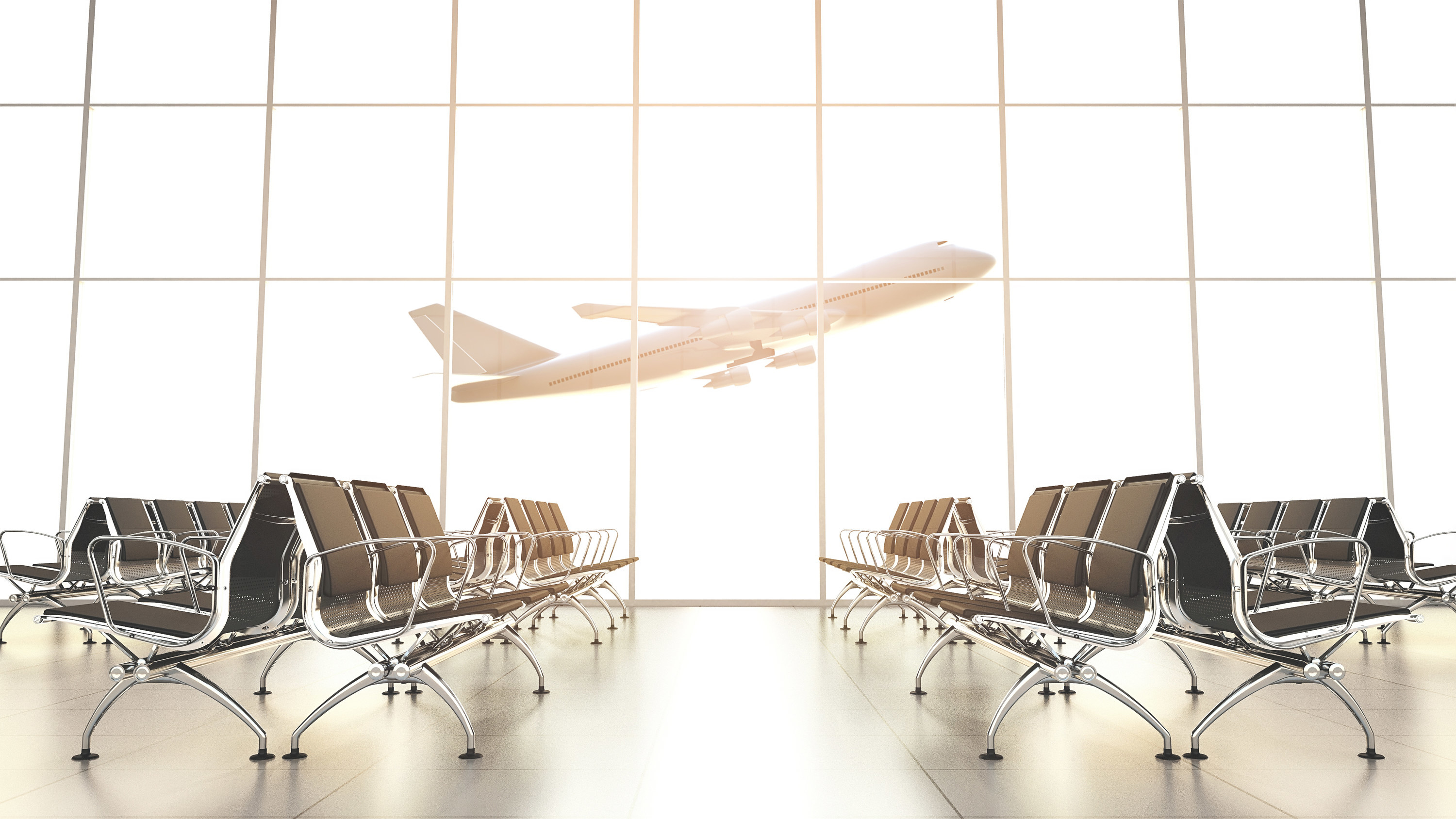 airport chairs empty while a plane takes off in the background