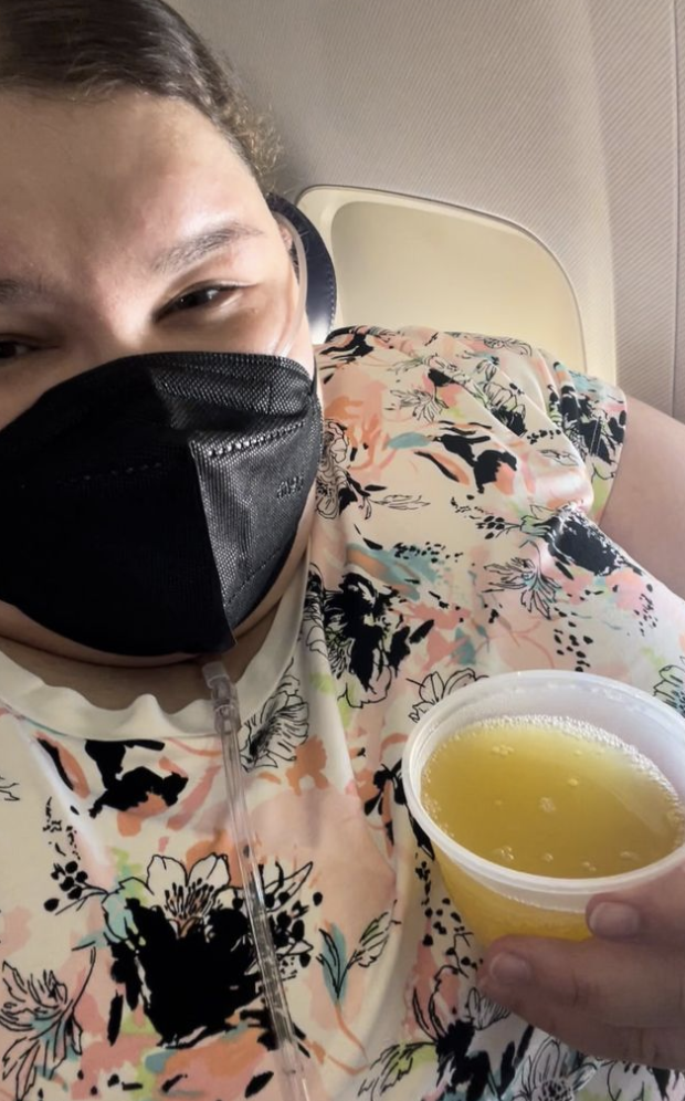 close up of Jae wearing a mask on the flight