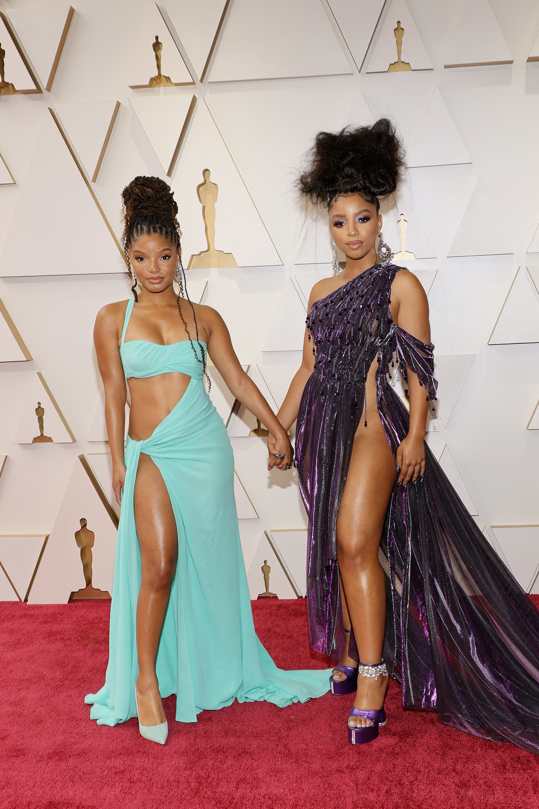 The sisters hold hands at on the Oscars red carpet