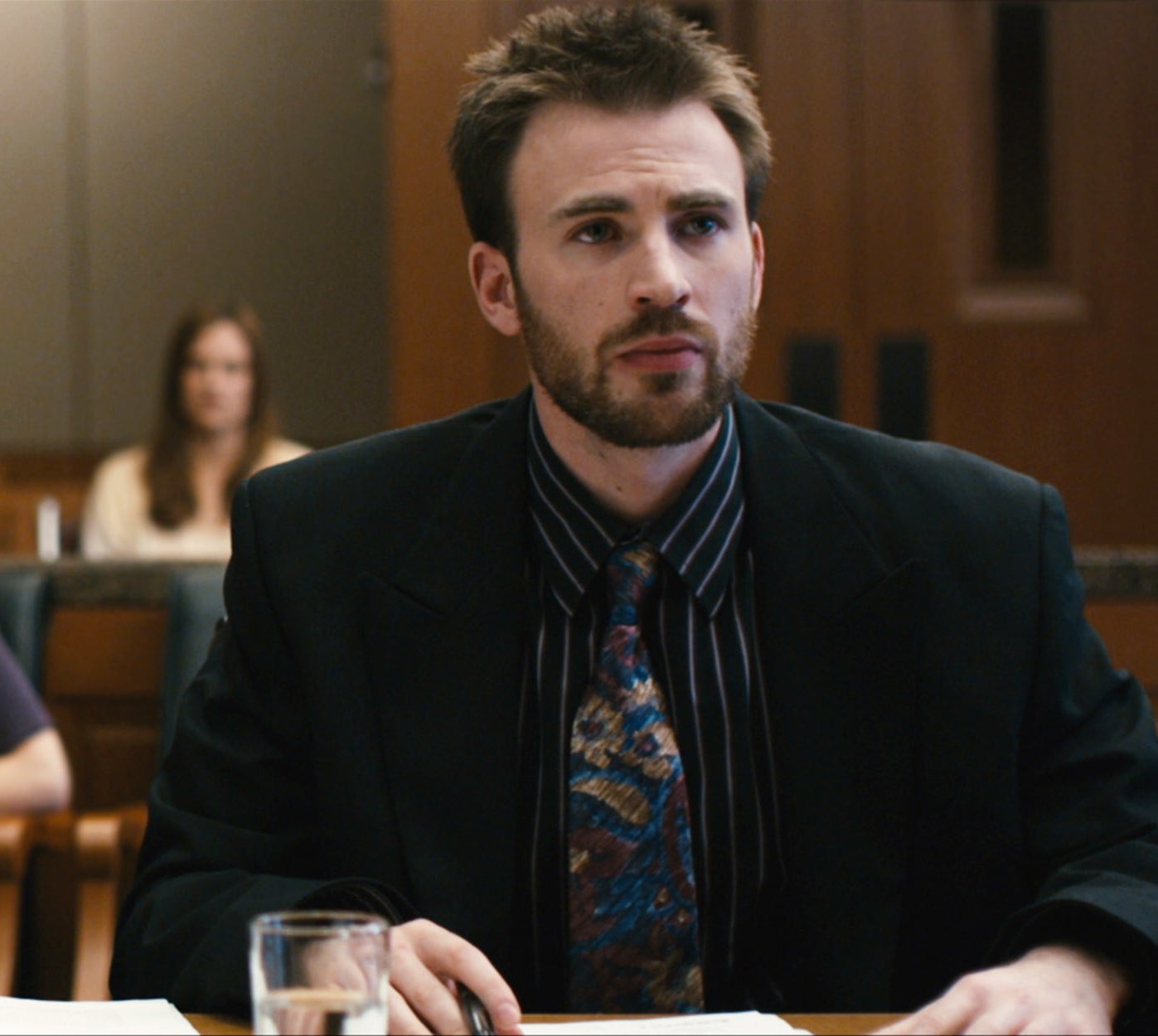 Chris Evans acting in a courtroom setting