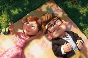 Ellie and Carl from Up lie on a picnic blanket and look up at the clouds