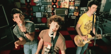 the brothers performing in a music video
