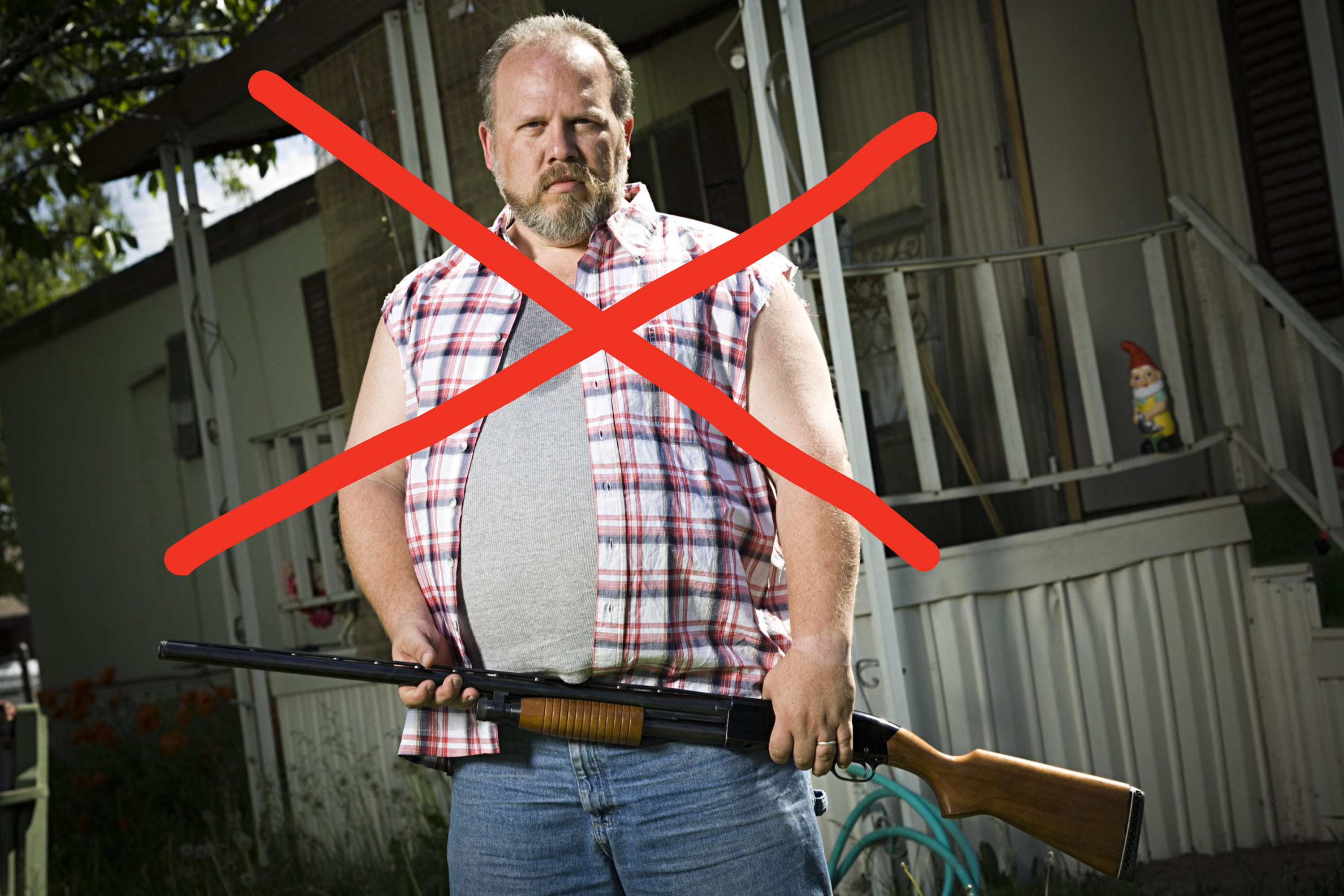 A redneck holding a gun with a big red cross drawn on top of him