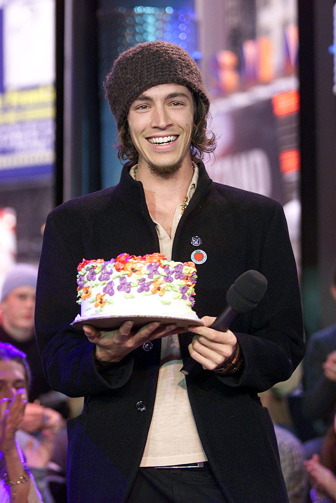 Brandon Boyd holding a cake