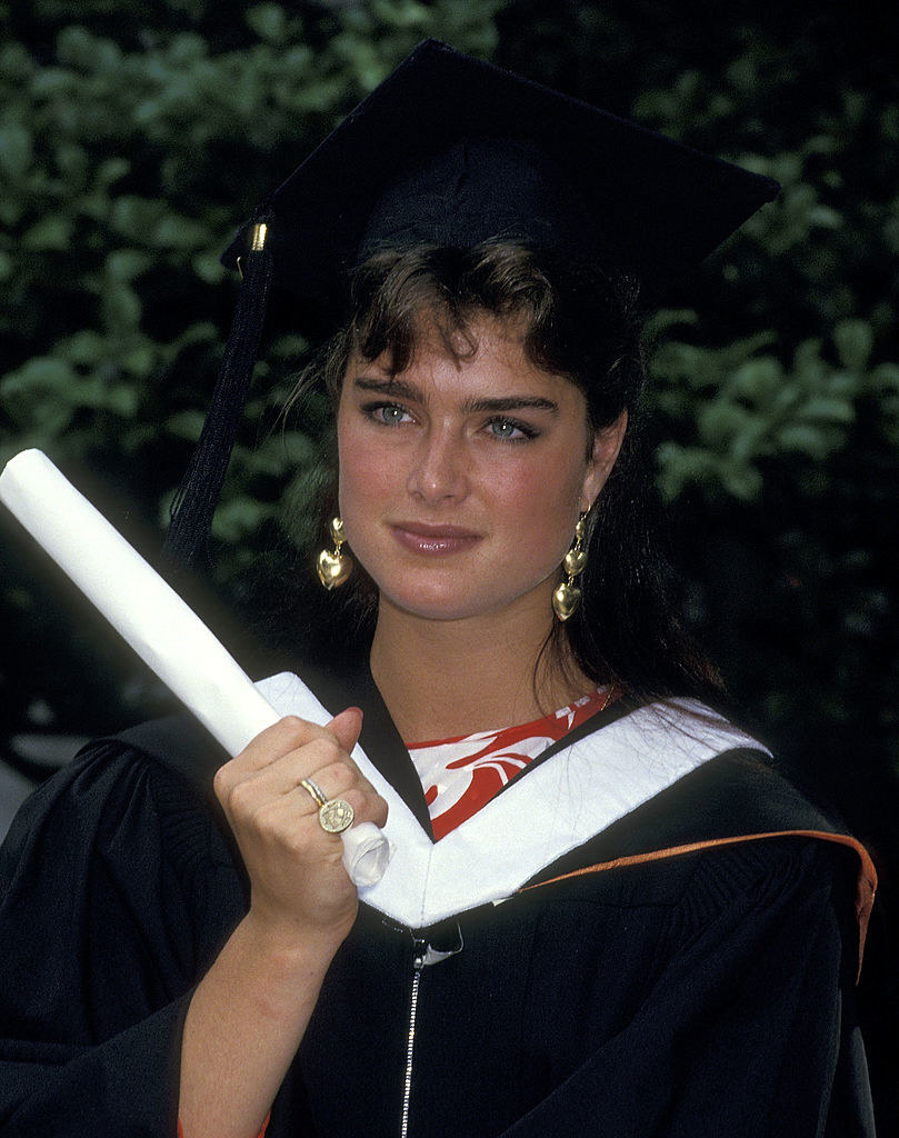 Brooke Shields holding her diploma