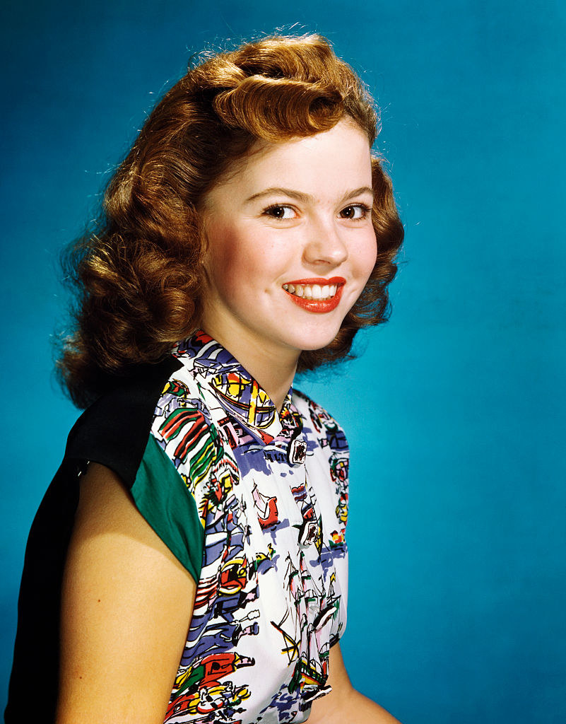 Headshot of a smiling Shirley as a young woman