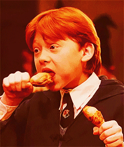 Scene from Harry Potter, Ron Weasley eating two drum stick wings