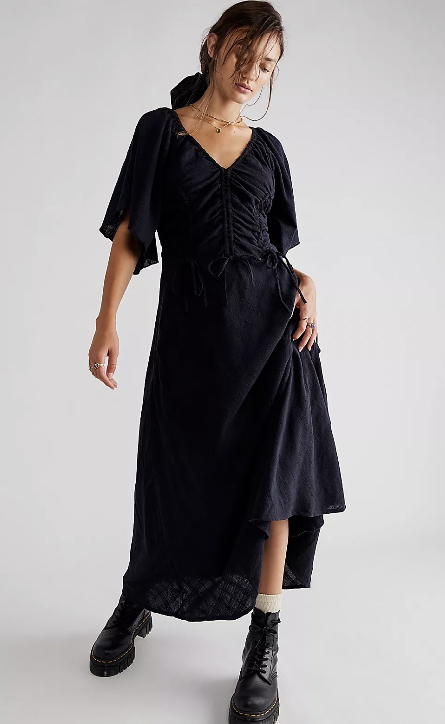 model wears the dress in black