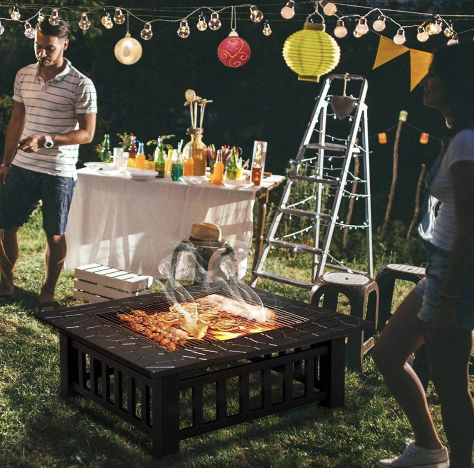 the square fire pit in a backyard during a party