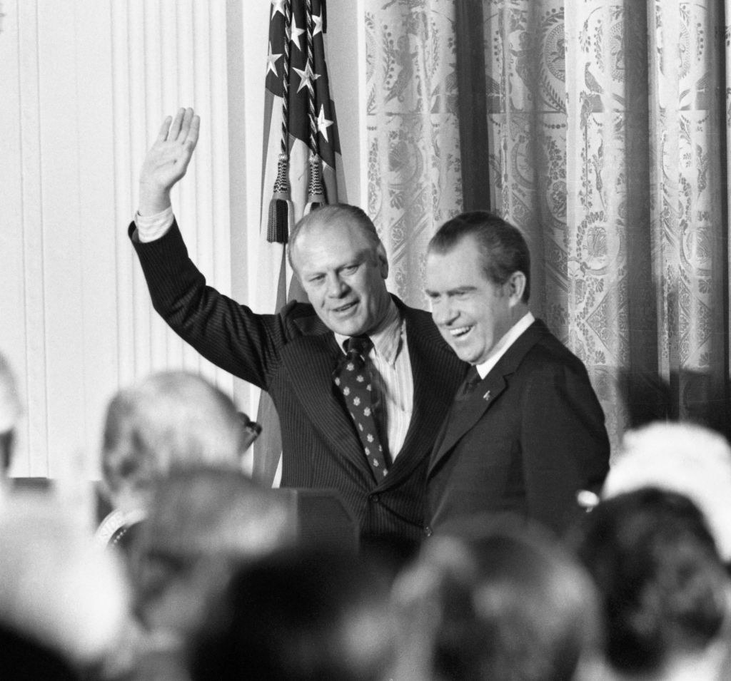 Ford and Nixon in front of a group of people