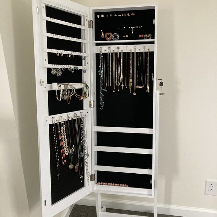 Reviewer photo inside of white mirrored armoire
