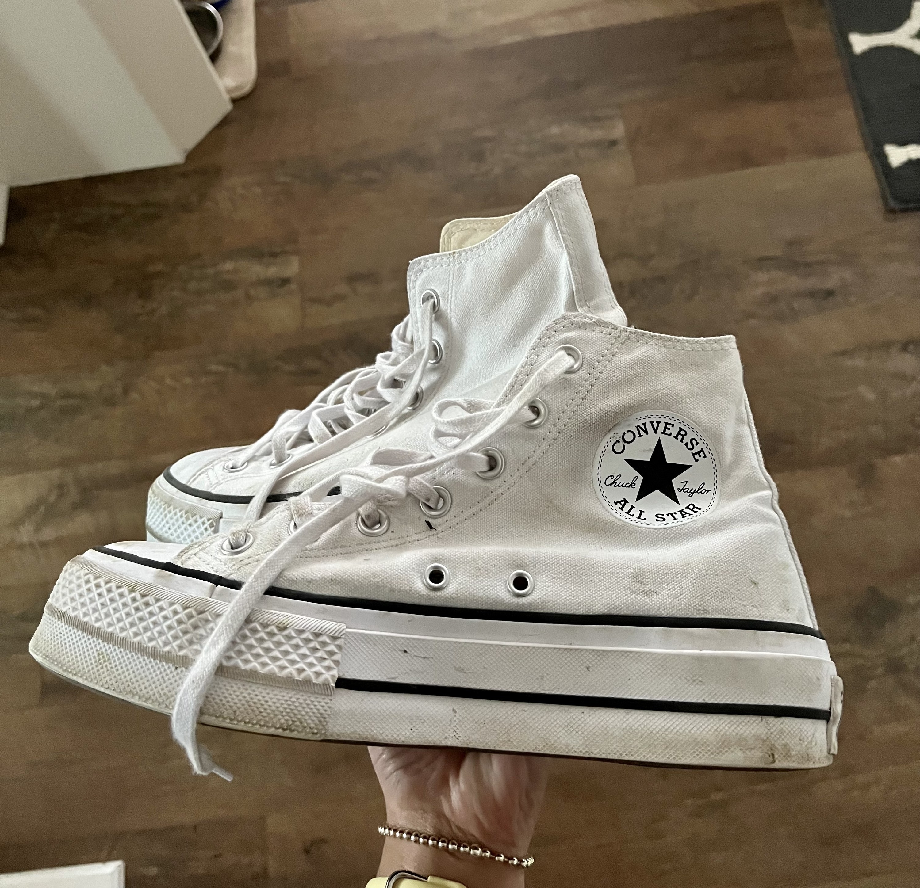 The pair of Converse in Melina&#x27;s hand