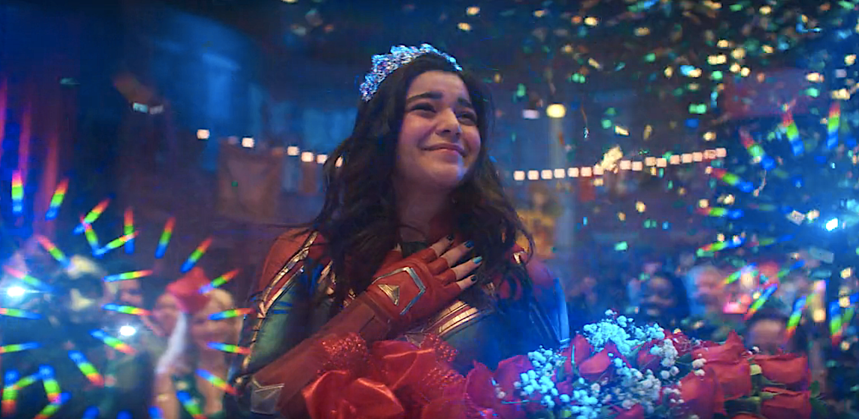 Kamala Khan wearing a tiara and smiling