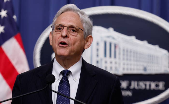 Merrick Garland speaks at a lectern with microphones