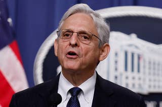 Merrick Garland speaks at a lectern with microphones