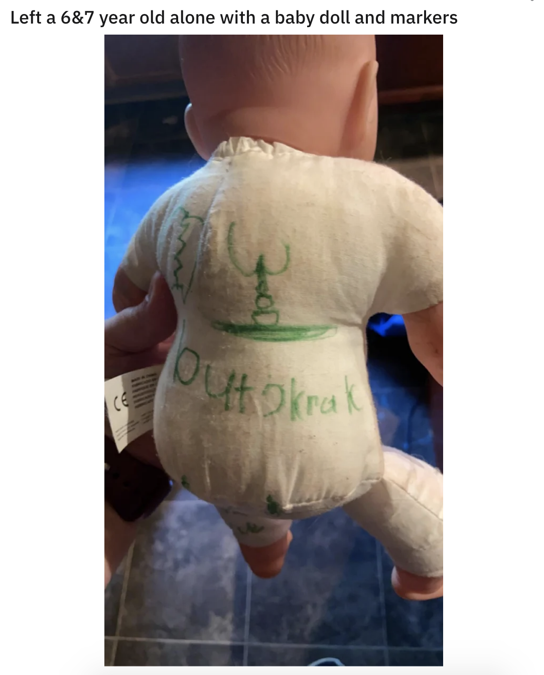 baby doll with a butt drawn on it