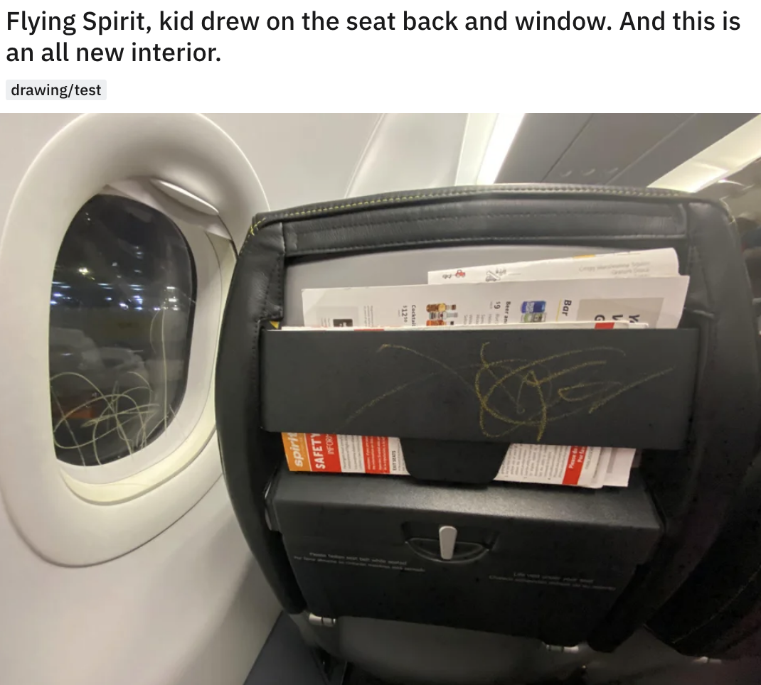 crayon on the back of a plane seat