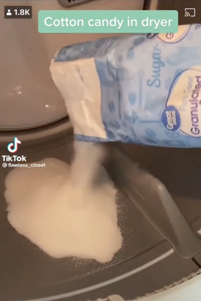 sugar being poured into a dryer slot