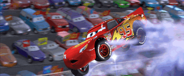 A racing car is driving fast and jumps into the air