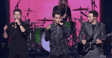 the jonas brothers performing on stage