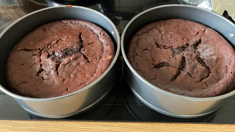 Two cakes in pans.