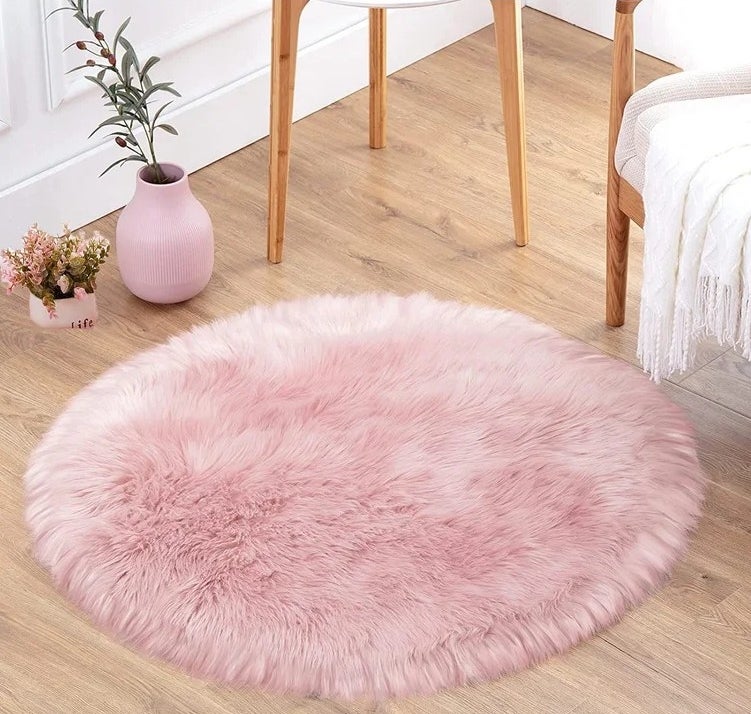 The pink shag faux sheepskin area rug