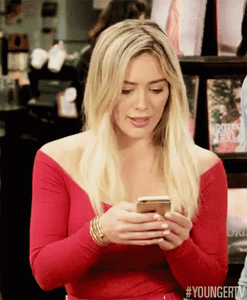 Gif of Hilary Duff using phone in &quot;Younger&quot;