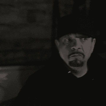 Gif of Ice-T on the show &quot;Celebrity Ghost Stories&quot; looking confused and concerned