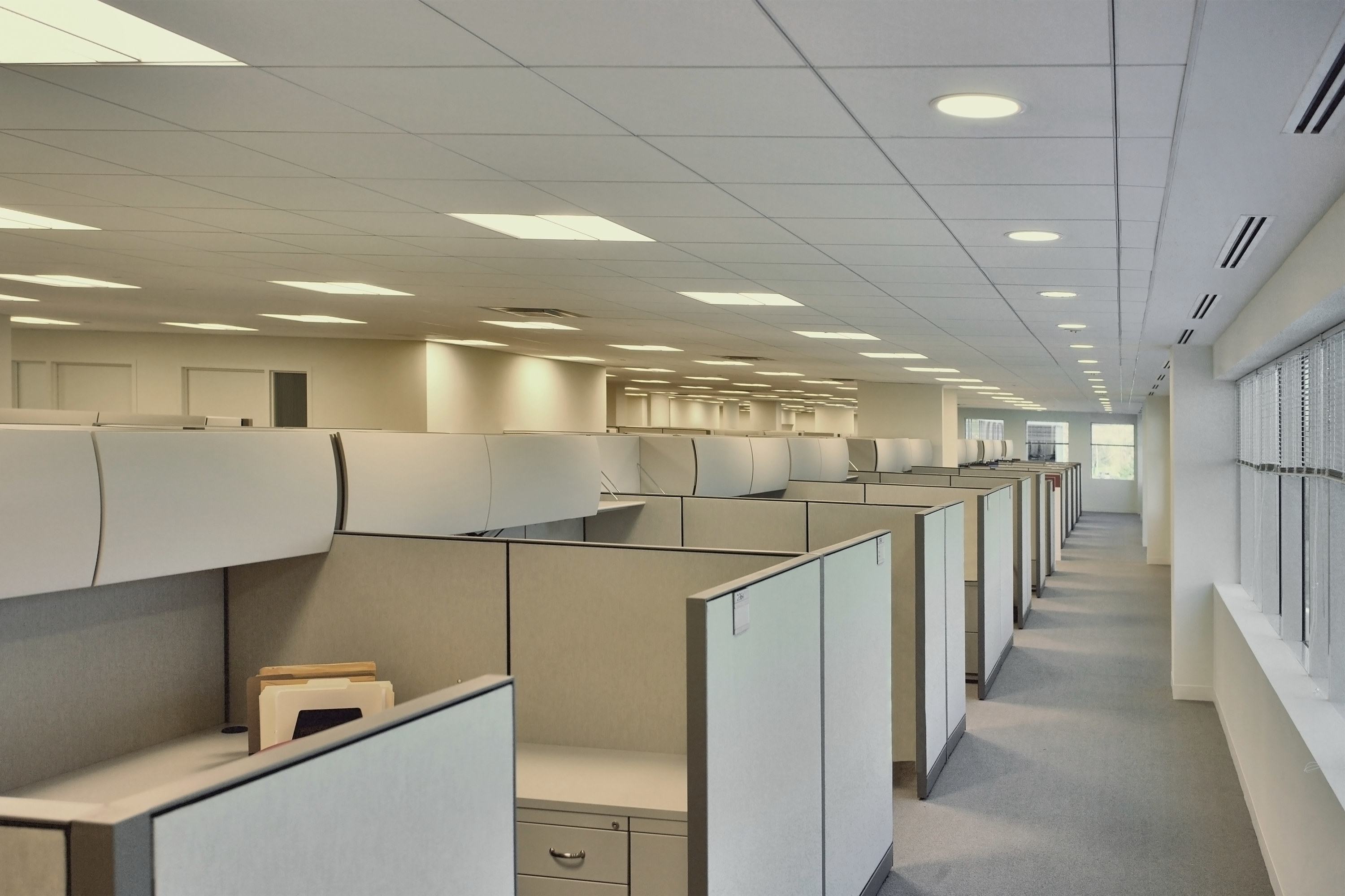 an empty office with cubicles