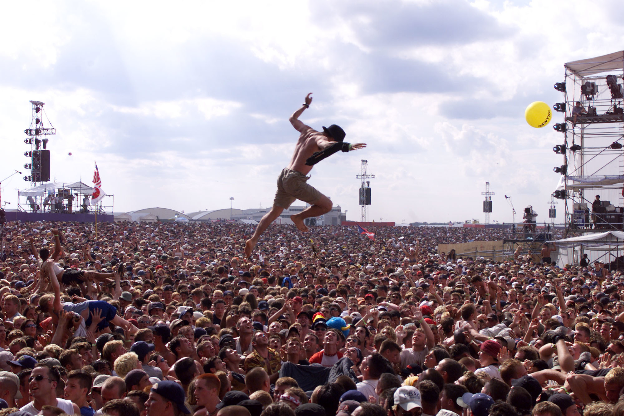a person jumping in the large crowd