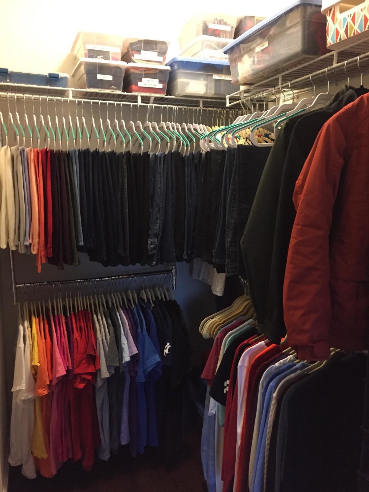 A customer review photo of the Simple Houseware adjustable closet hanging rod in chrome hanging in their closet