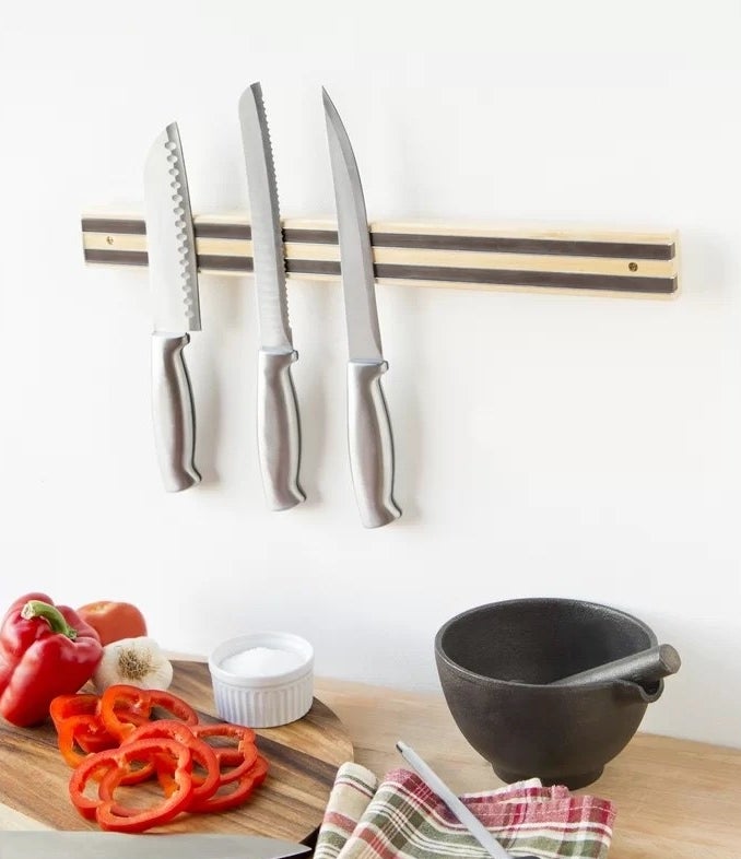 knives hanging on the magnetic knife holder