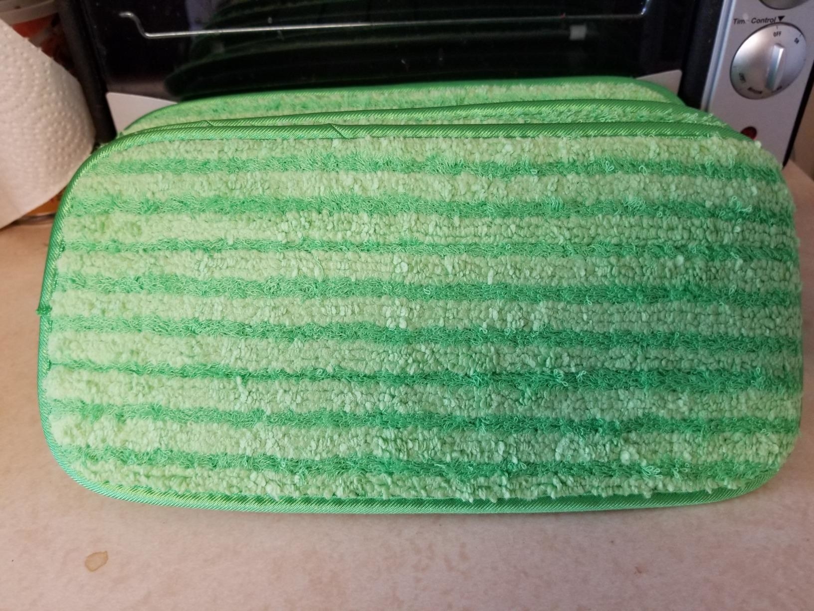 Reviewer&#x27;s photo of the green microfiber pads