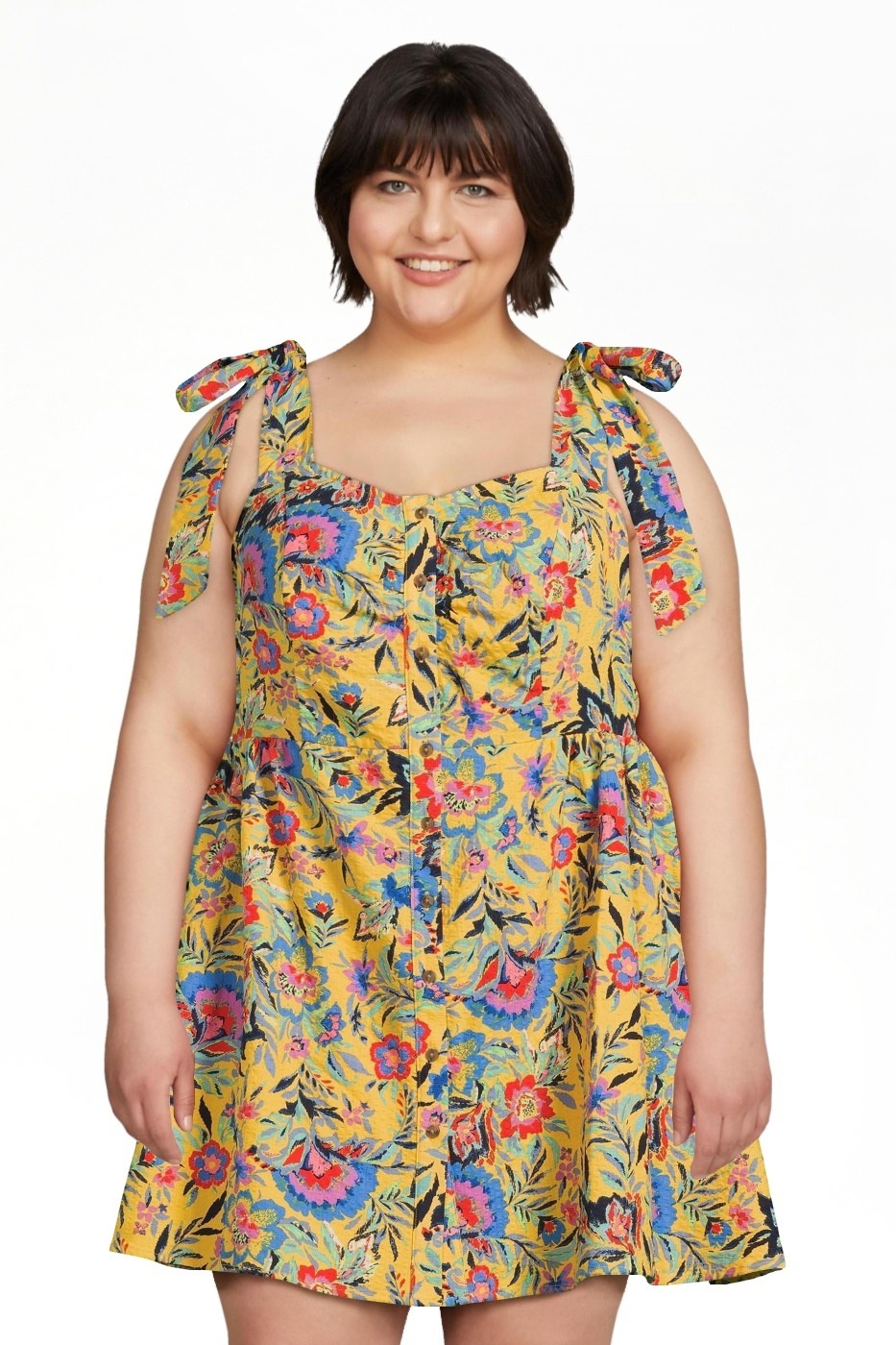 a model wearing the yellow floral dress