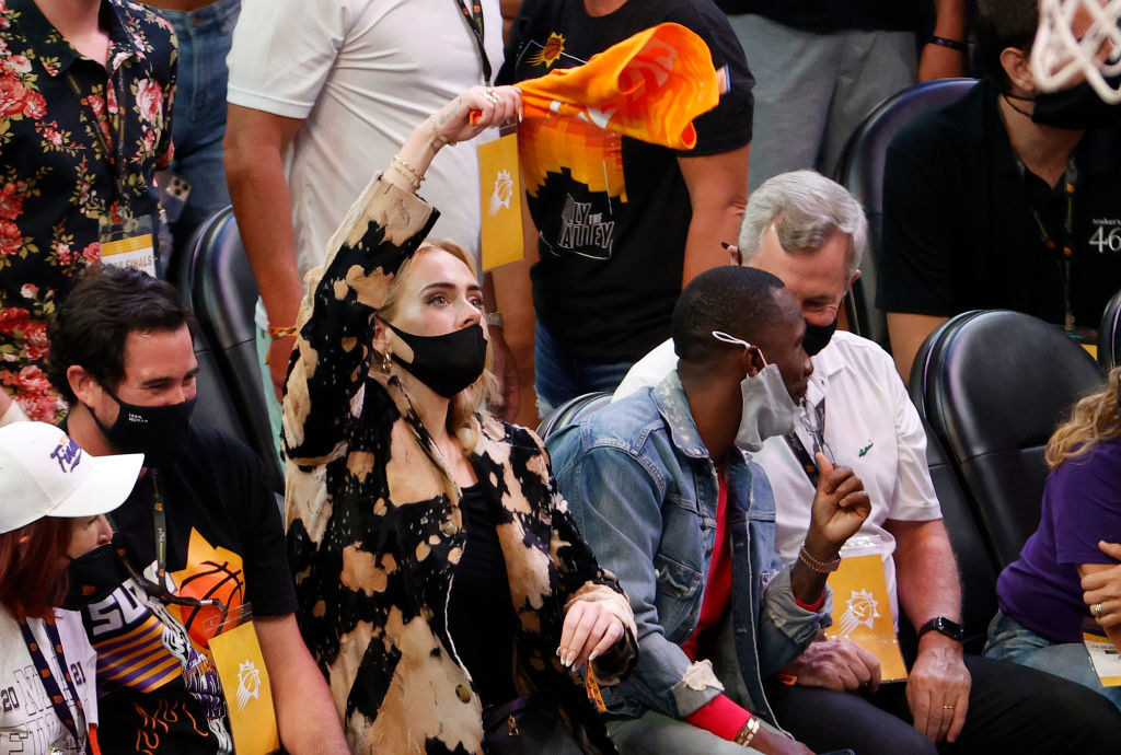 Adele cheering during a Phoenix Suns game with her boyfriend Rich Paul