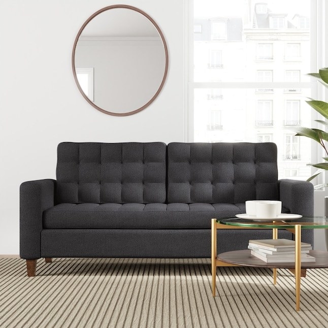 the gray tufted sofa