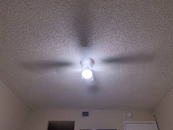 reviewer image of lightbulb in ceiling light fixture